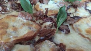 Pizza with Mozzarella scamorza radicchio and sausage